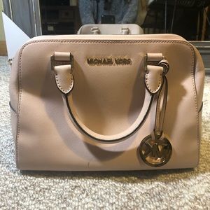 Blush pink Michael Kors handbag with straps